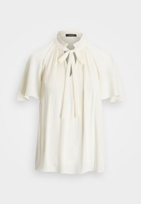 Blouse blanche avec un design plissé, fermeture par nœud papillon et manches courtes évasées. Texture lisse et tissu léger.