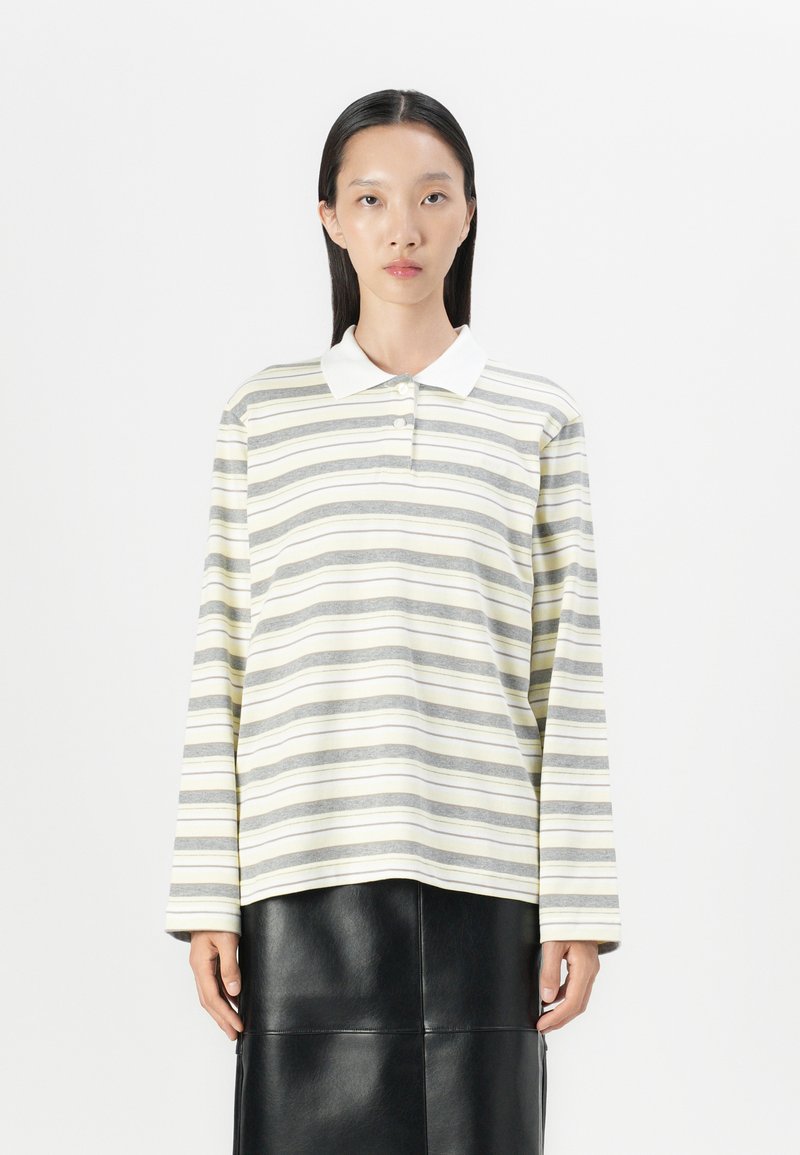 Long-sleeve polo shirt made of cotton, featuring horizontal stripes in gray and yellow, with a white collar and buttoned placket.