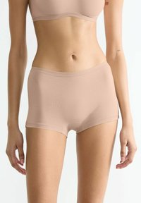 Beige cotton blend hipster shorts with a smooth texture, elastic waistband, and a fitted design, suitable for everyday wear.