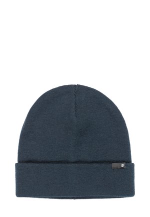 Bonnet en tricot bleu foncé, avec un revers et une petite étiquette. Texture lisse avec un design simple et épuré.