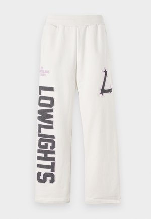 Cream-colored sweatpants with a relaxed fit, featuring "LOWLIGHTS" in dark grey text and a stylized purple "L" logo on the side.