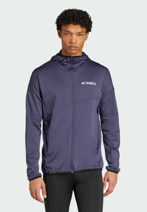 Navy hooded jacket with full zipper, branded "TERREX" on the chest, featuring a front pocket and textured fabric for added warmth.