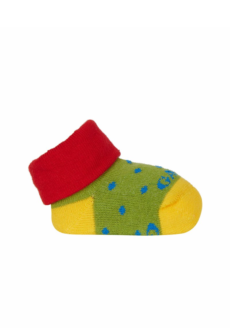Calzino verde con un polsino rosso e punta gialla; presenta pois blu e un maglione a trama. Progettato per neonati o bambini piccoli.