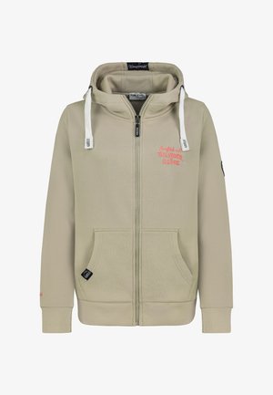 Beige zip-up hoodie made from soft fabric. Features drawstrings, front pockets, and embroidered text. Ribbed cuffs and hem.