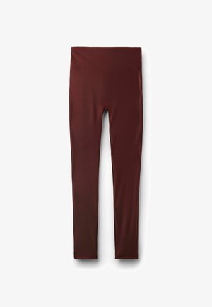 Leggings taille haute, longueur intégrale, sans coutures, de couleur bordeaux foncé, en tissu lisse et extensible, sans logos ni motifs visibles.