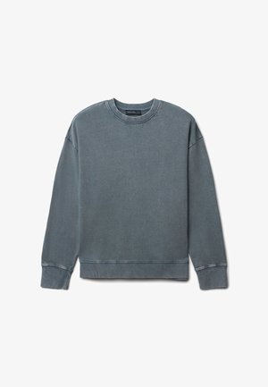 Felpa in cotone grigio sbiadito, girocollo, maniche lunghe, polsini e fondo a costine, vestibilità rilassata con dettagli di cucitura in vista.