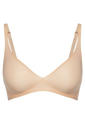Nude draadloze bh met voorgelote cups, verstelbare schouderbandjes en een glad, naadloos ontwerp. Lichtgewicht stof met een zachte textuur.