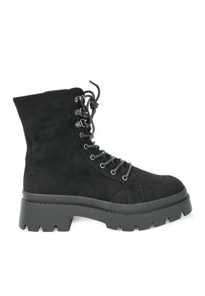 Black suede ankle boot with a chunky rubber sole, prominent lace-up front, metal eyelets, and padded collar.