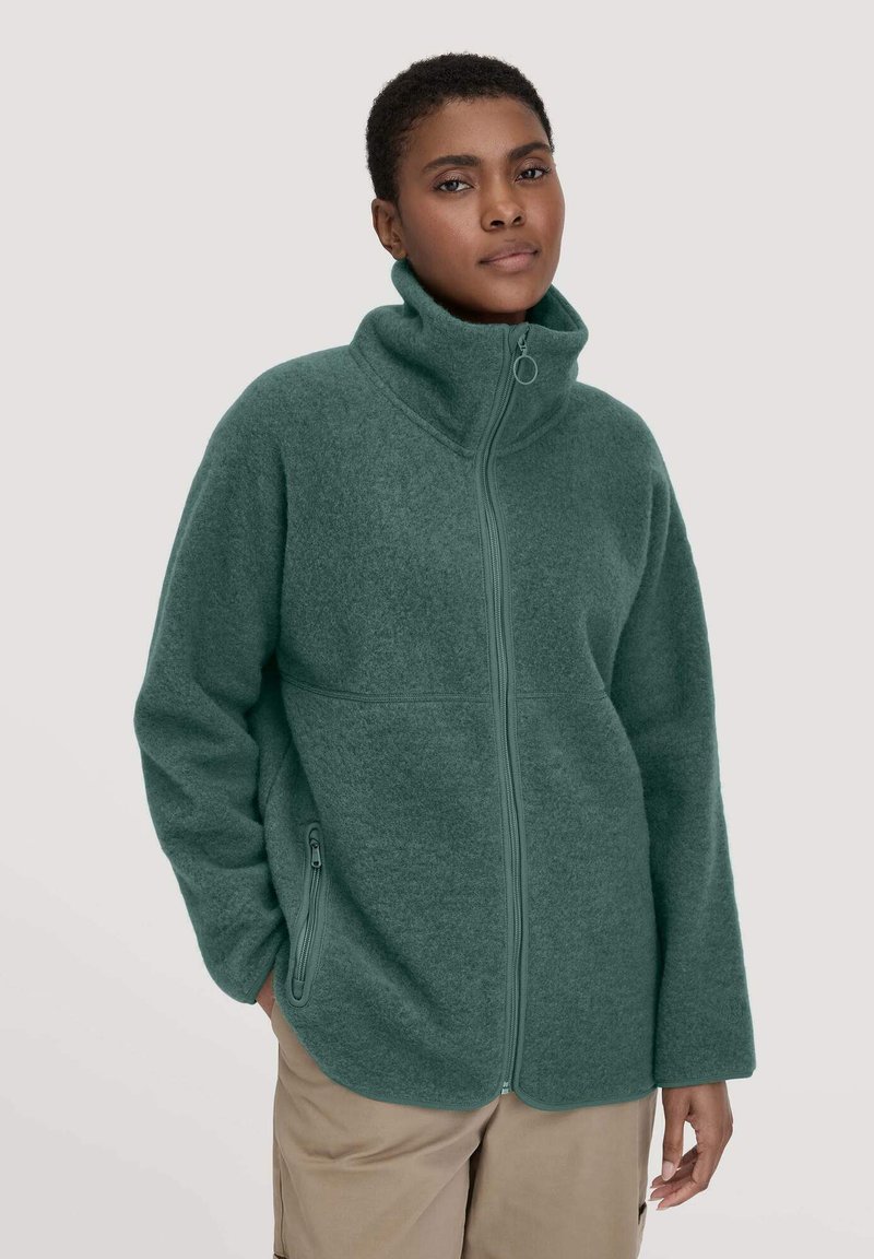 Teal fleece jacket with high collar, zip-up front, and side pockets; features soft texture and relaxed fit.