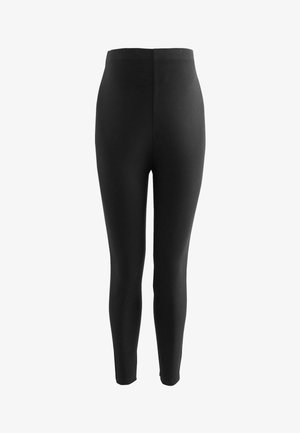 Mustat leggingsit, jotka on valmistettu joustavasta kankaasta, varustettu korkealla vyötäröllä ja tiukalla muotoilulla, joka kapenee nilkassa.
