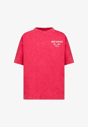 Rode, oversized katoenen T-shirt met een ronde hals. Voorzien van witte tekst "BON VOYAGE" en een spijkerstof labeldetail op de borst. Vintage wastetekstuur.