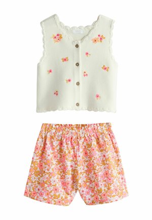 Cream knit sleeveless buttoned vest with pink and yellow embroidered flowers, paired with pink, orange, and white floral patterned shorts.