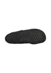 Black sneaker outsole with hexagonal pattern. Features textured rubber for grip, with subtle branding and a smooth finish along edges.