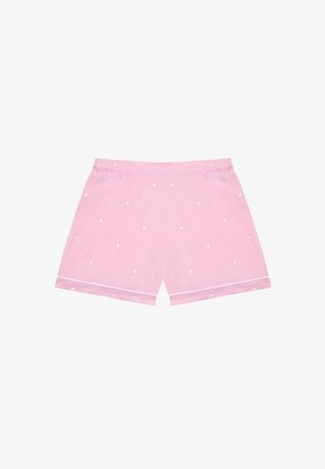 Shorts in cotone rosa con pois bianchi, dotati di una vita elastica e rifinitura bianca lungo l'orlo. Finitura liscia e texture morbida.
