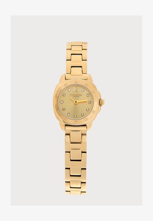 Reloj de pulsera de metal dorado con correa enlazada, esfera redonda, marcadores de hora de cristal y el nombre de la marca Coach New York en la esfera.
