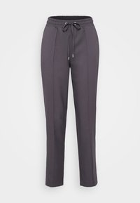 Pantalons de jogging gris avec une taille élastique, fermeture par cordon de serrage et détails de couture latéraux. Fabriqués en tissu doux et texturé.