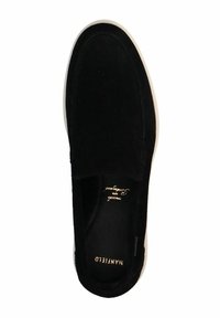 Black suede slip-on shoe with a round toe, minimal design, and white rubber sole. Features embossed branding inside the shoe.