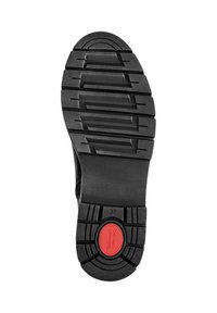 Suela de zapato de goma negra con un patrón de dibujo profundo, que presenta un acento circular rojo y tamaño marcado como 37. Superficie texturizada para un buen agarre.