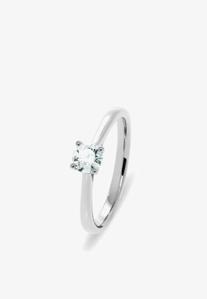 Solitärring aus poliertem Weißgold mit einem einzelnen runden, klaren Diamanten, gehalten von vier Krappen. Glatter, schlanker Ring mit reflektierendem Finish.