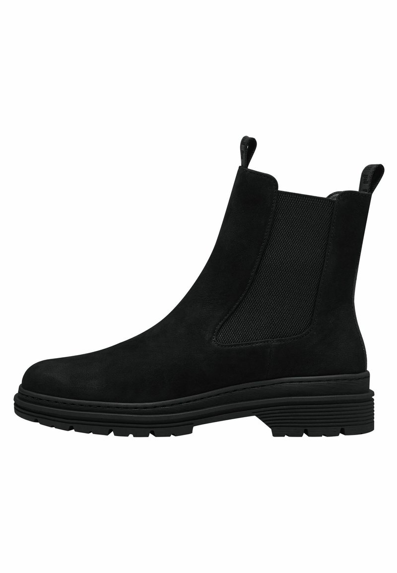Botte Chelsea en daim noir avec panneaux latéraux élastiques, languettes de traction, et semelle en caoutchouc épaisse avec dessous à crampons.