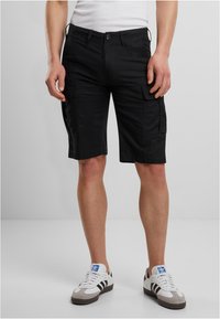 Shorts cargo noirs en tissu mélangé coton, dotés de multiples poches, d'une coupe droite et d'un ourlet au-dessus du genou.