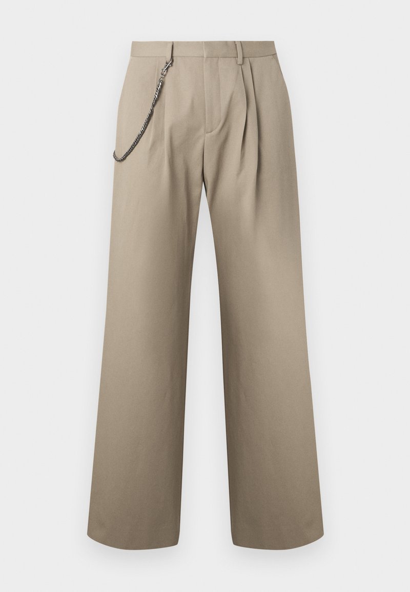 Beige wide-leg trousers with front pleats and a metal chain attached to the left belt loop for style.