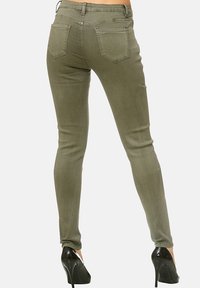 Elara STRETCH - Vaqueros pitillo - grün