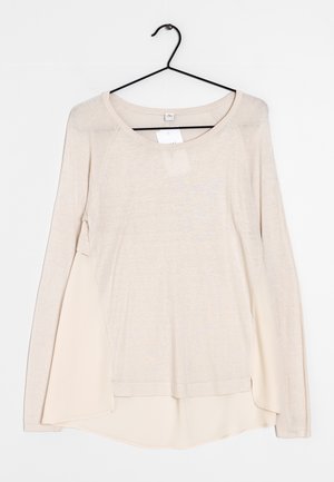 Stickad tröja - beige