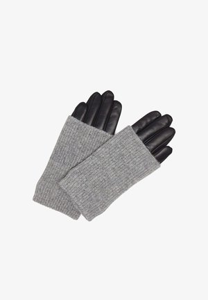 Mânuși fără degete din tricot gri cu vârfuri din piele neagră, evidențiind texturi contrastante și un design strâns pentru a oferi căldură.