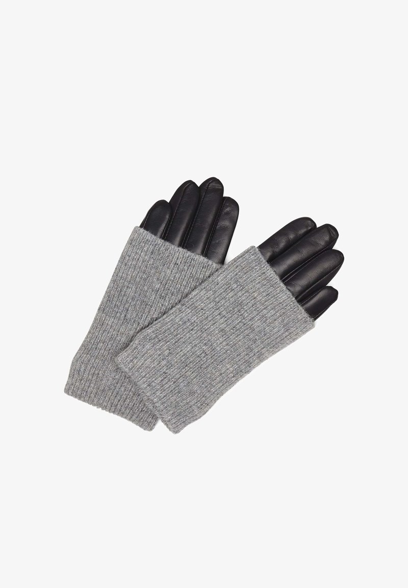 Mânuși fără degete din tricot gri cu vârfuri din piele neagră, evidențiind texturi contrastante și un design strâns pentru a oferi căldură.