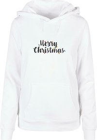 Vit hoodie med framficka, som har texten "God Jul" i svart med färgglada ljusaccent. Mjuk struktur, standard passform.
