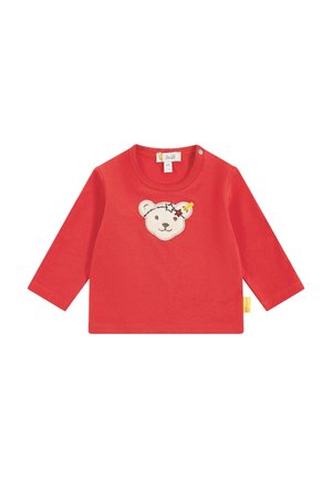 Maglietta rossa a maniche lunghe in cotone, caratterizzata da un volto di orso ricamato con stelle. Include una chiusura a pressione sulla spalla.