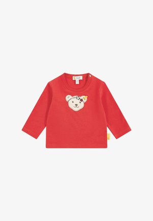 Rode langemouwen shirt van katoen, met een geborduurde berenkop en sterren. Inclusief drukknopen op de schouder.