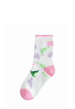 White sock with pink heel and toe, featuring green witch hats, purple crowns, floral designs, and pink "WICK" text.
