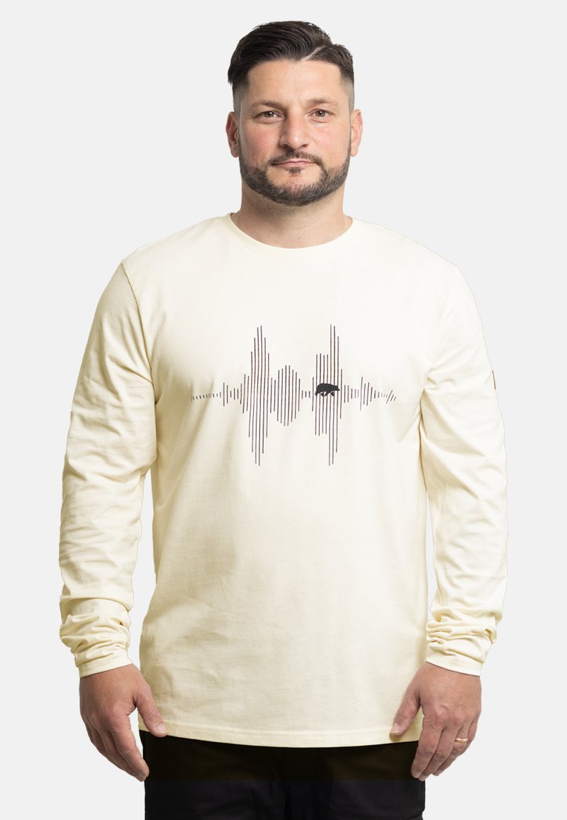 Langärmliges, cremefarbenes T-Shirt aus Baumwolle mit einem schwarzen Schallwellen-Graphic über der Brust. Rundhalsausschnitt und lockere Passform.