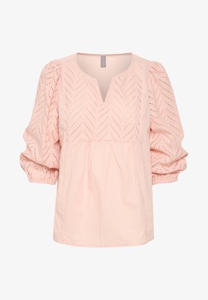 Lichtroze blouse van katoen, met een V-hals, kraagmouwen en geometrische stippatronen door de stof heen.