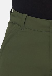 Olive green trousers made of lightweight material, featuring a zip and button closure, belt loops, and side pockets with a smooth texture.