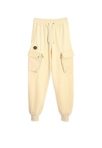 Pantalones cargo de color crema con puños el�ásticos, una cintura con cordón y dos grandes bolsillos laterales con cierres a presión.