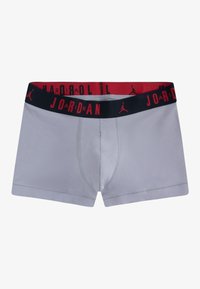 Gray boxer shorts with a black and red elastic waistband featuring "JORDAN" text and logo. Soft fabric with a fitted shape.