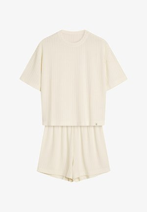 Cremefarbenes, geripptes Zweiteiler-Set, bestehend aus einem kurzärmligen Oberteil und Shorts bis zur Mitte des Oberschenkels mit elastischem Bund.