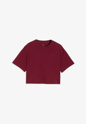 Bordeaux cropped t-shirt med korte ærmer og rund halsudskæring, med et lille Puma-logo på venstre bryst.