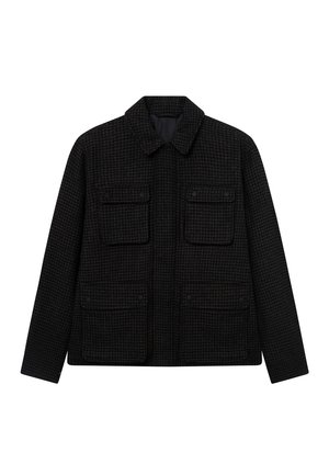 Μαύρο σακάκι σε σχέδιο houndstooth με γιακά, δύο μπροστινές τσέπες με καπάκι και ευθεία γραμμή. Φτιαγμένο από υλικό με υφή, κατάλληλο για στρώσεις.