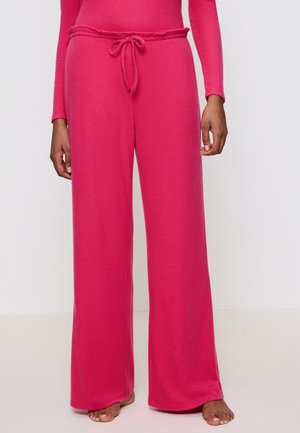 Rosa Loungewear-Hosen aus weichem Material, mit entspanntem Schnitt, weitem Bein und einem verstellbaren Bund mit einfachem Knoten-Detail.