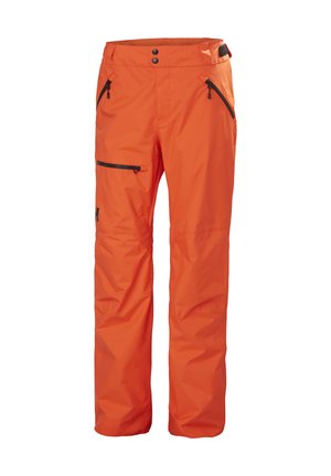 Orangene wasserdichte Schneehosen mit glatter Textur, zwei seitlichen Reißverschlusstaschen und einer Reißverschlusstasche am Oberschenkel. Mit verstellbarem Bund.