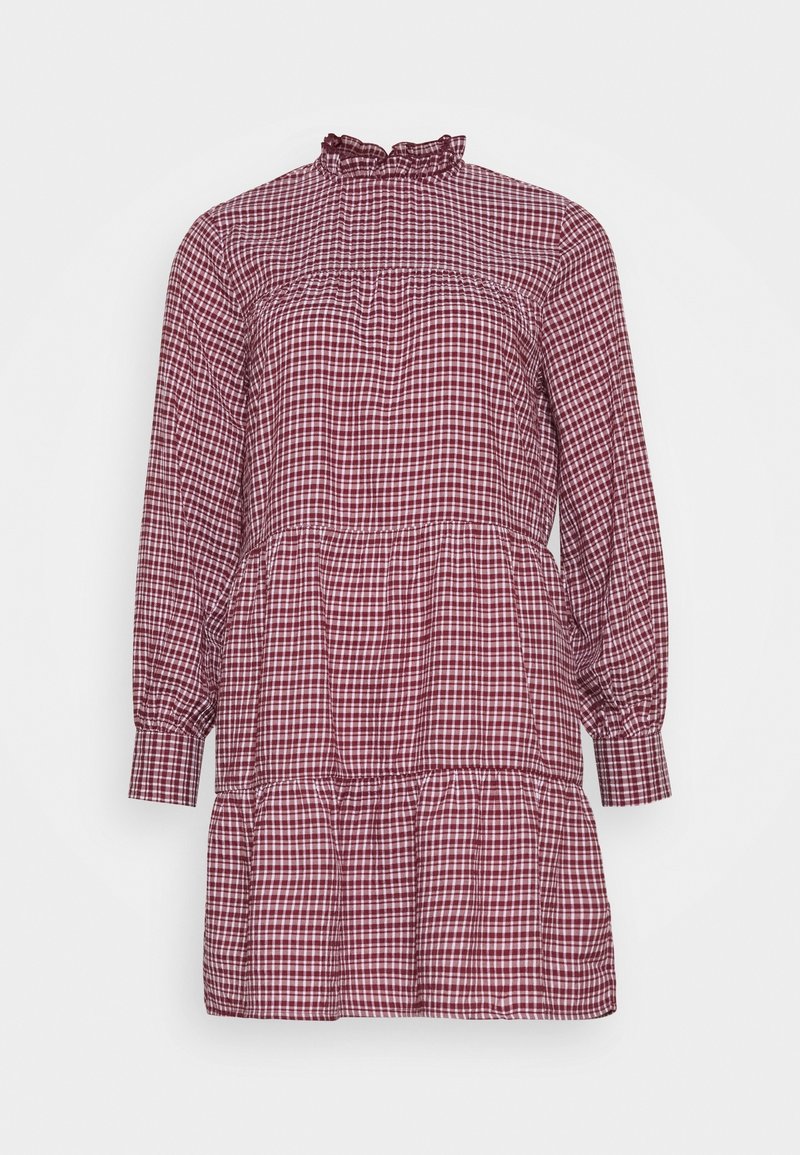 Red and white checkered dress with a ruffled high neck, long sleeves, and a tiered hem. Made from fabric with a lightweight texture.