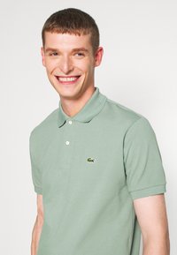 Lacoste Polo majica - light green melange