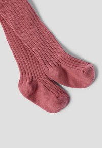 Chaussettes côtelées, montantes jusqu'aux genoux, dans une couleur rose douce. Fabriquées en un matériau lisse avec un renfort aux orteils et au talon.