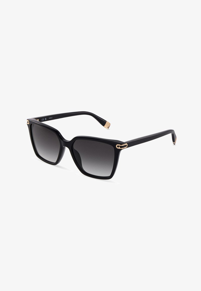 Lunettes de soleil carrées oversize noires avec verres foncés dégradés et détails dorés sur les charnières et les embouts.