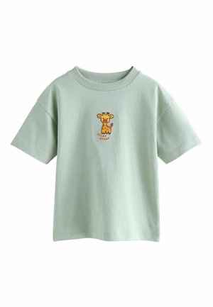 Light green short-sleeve shirt with a small embroidered cartoon giraffe and the words "STOMP STOMP" on the chest.