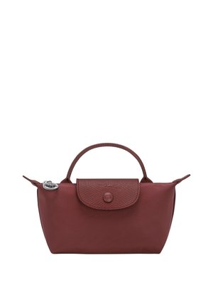 Small burgundy handbag with a textured flap, single top handle, and silver zipper pull charm on a white background.